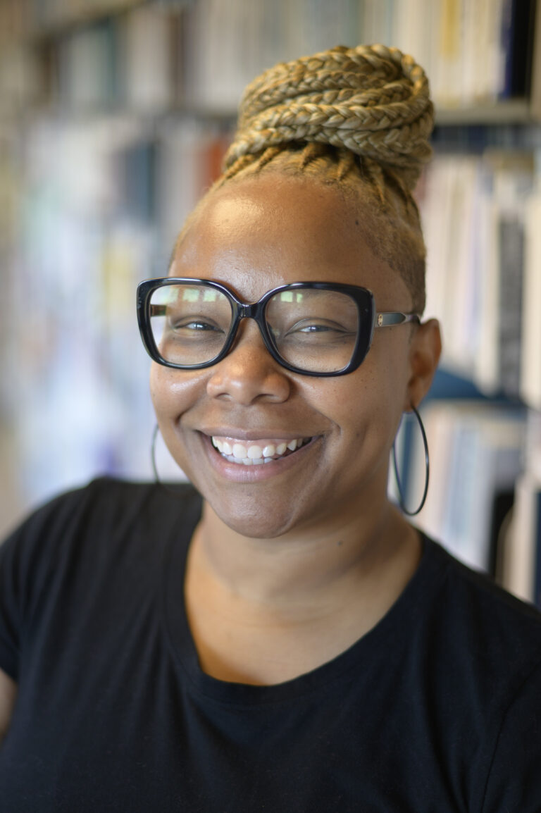 Kishonna Gray poses in the UM video game archive